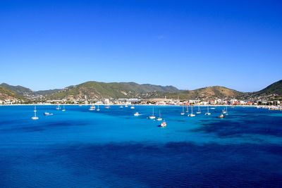 Scenic view of sea against clear blue sky