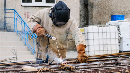 Man working on metal structure