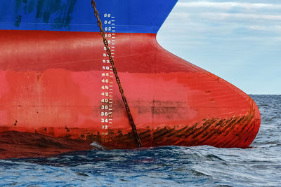 Sailboat in sea against sky