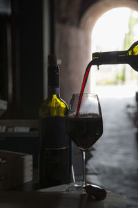 Close-up of wine bottles on table