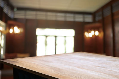Empty table by illuminated building