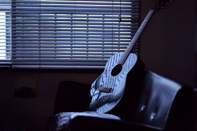 Close-up of guitar at home