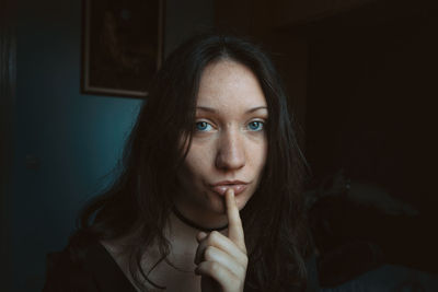 Portrait of smiling young woman at home