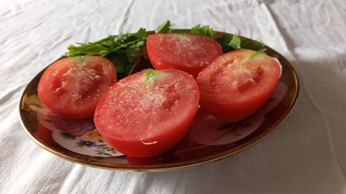 High angle view of fruits in plate on table