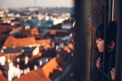 Close-up of cityscape seen through window