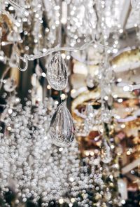 Close-up of christmas decoration hanging on glass