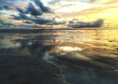 Scenic view of sea against cloudy sky