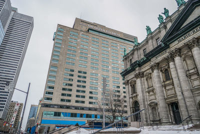 Low angle view of skyscrapers against sky