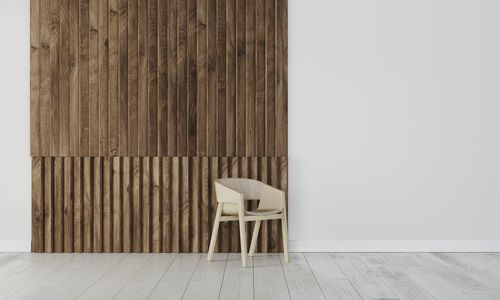 Empty chairs and table against wall at home