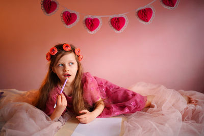Girl writes a valentine
