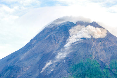 Scenic view of volcanic mountain against sky