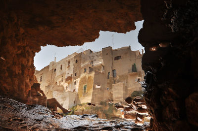 Buildings seen through cave