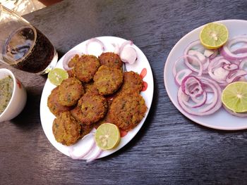 High angle view of fruits in plate on table