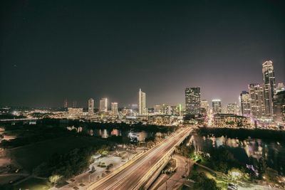 High angle view of illuminated city at night