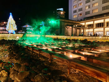 Illuminated buildings in city at night