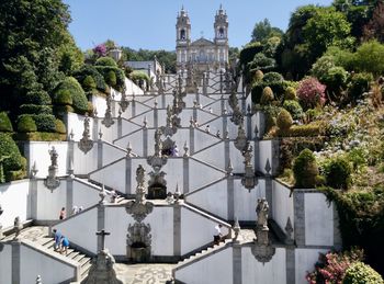 Traditional building by trees against sky