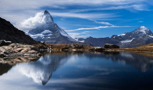 Scenic view of snowcapped mountains against sky