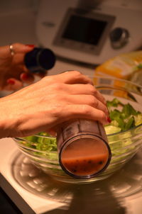 Close-up of person preparing food in kitchen