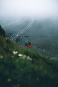 High angle view of overhead cable car on foggy weather