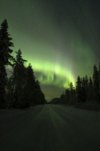 Scenic view of road against sky at night