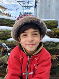 Portrait of smiling boy in snow