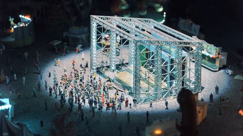 High angle view of illuminated decorations on street in city at night