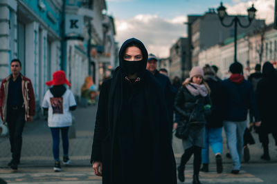People standing on street in city