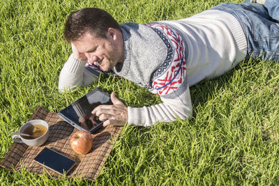 Side view of man using mobile phone