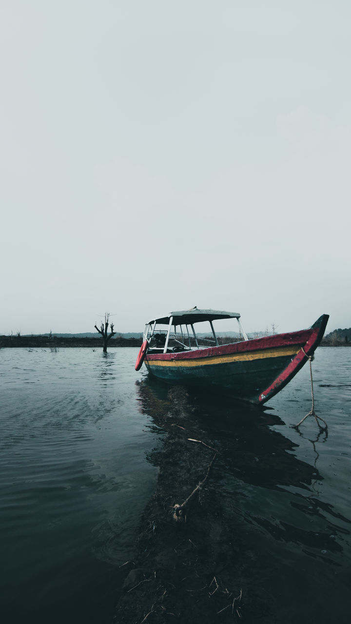 FISHING BOAT ON SEA AGAINST CLEAR SKY