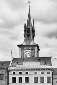 Low angle view of building against cloudy sky