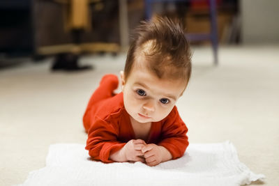 Portrait of cute baby on bed