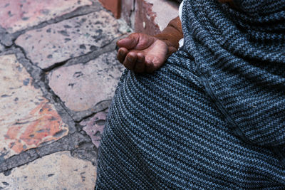 Close-up of man holding hands