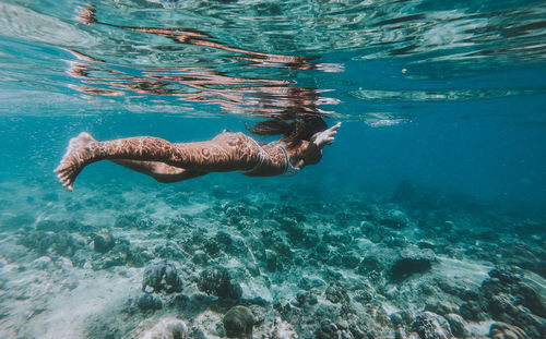 Woman swimming in sea