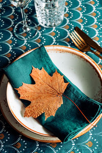 High angle view of maple leaves on table