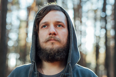 Close-up of bearded man looking away