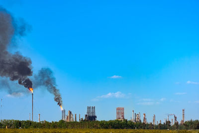 A hydrocarbon plant polluting the environment in the city of mendoza, argentina.