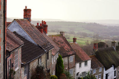 High angle view of residential buildings against sky