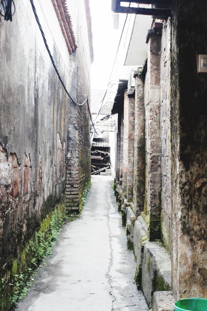 NARROW FOOTPATH AMIDST BUILDINGS