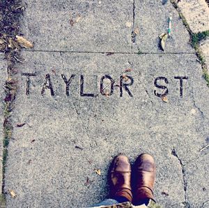 Low section of woman standing on tiled floor