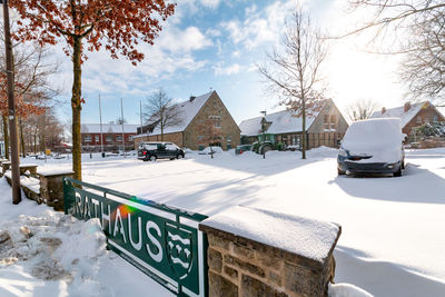 View of cars on snow covered landscape