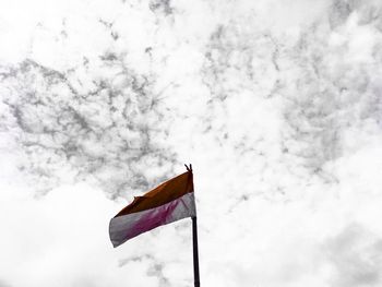 Low angle view of flag against sky