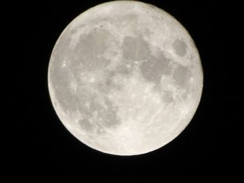 Low angle view of full moon at night