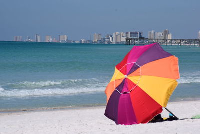 Lifeguard hut on beach against clear sky