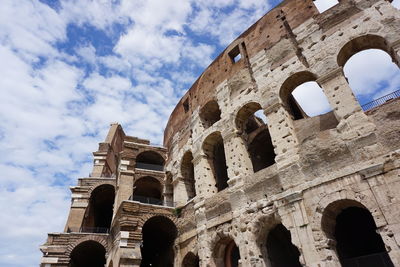 Low angle view of colosseum against sky