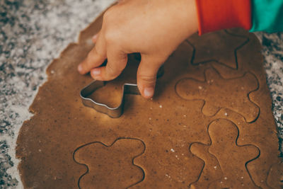 Cropped hand holding jigsaw puzzle