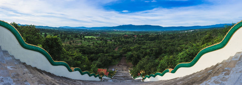 Scenic view of mountains against cloudy sky