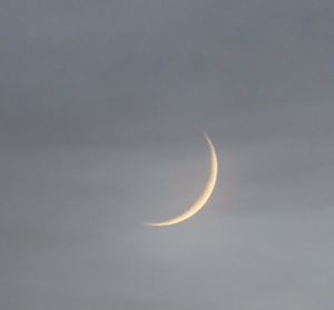 Low angle view of moon against sky at night