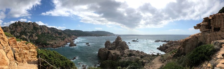 Panoramic view of sea and rocks against sky