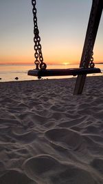 Scenic view of beach against sky during sunset