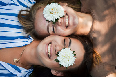 Portrait of beautiful woman with white flower